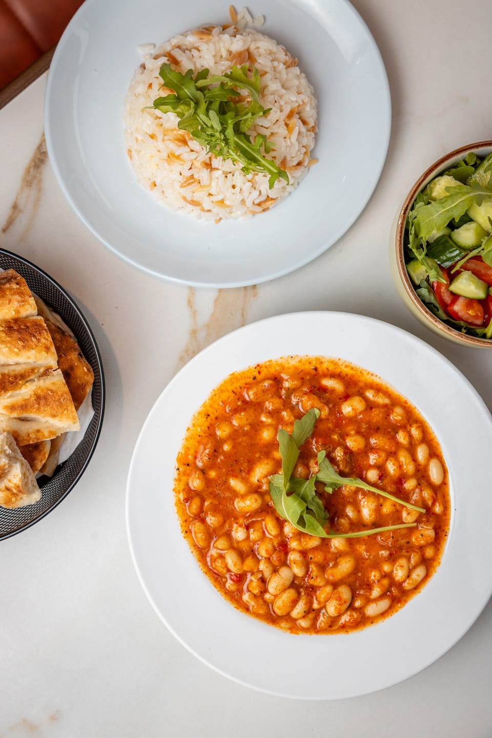 Kuru fasulye bean stew with rice pilau and salad