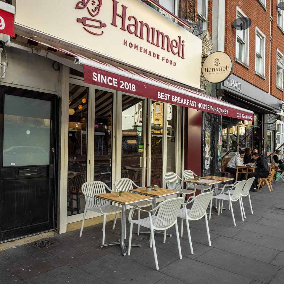 The Hanımeli shopfront on Stoke Newington Road with tables on the pavement
