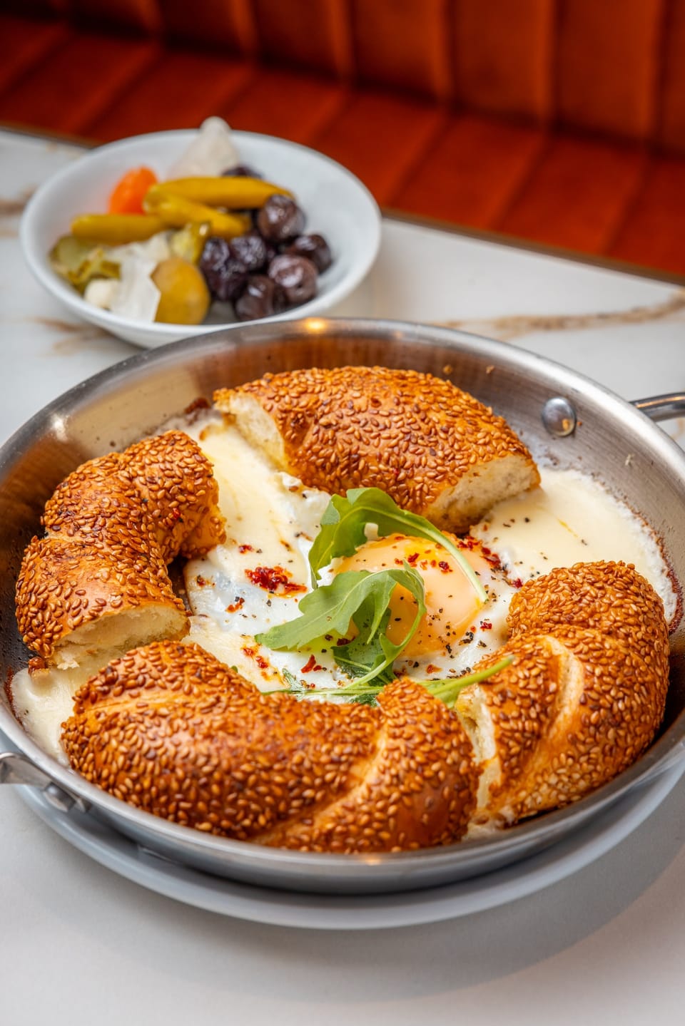 Simit tava: sesame simit baked with egg and melted cheese in the pan